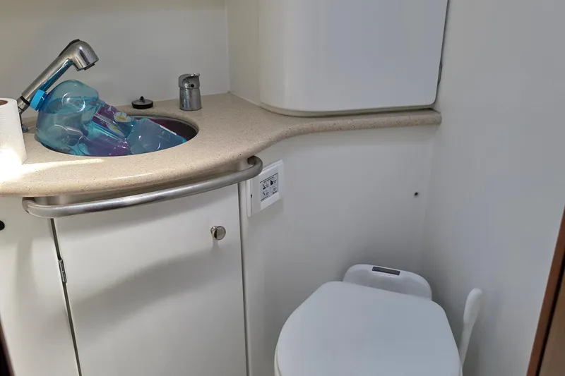 2007 Jeanneau 49 Performance yacht bathroom with sink, faucet, and toilet.