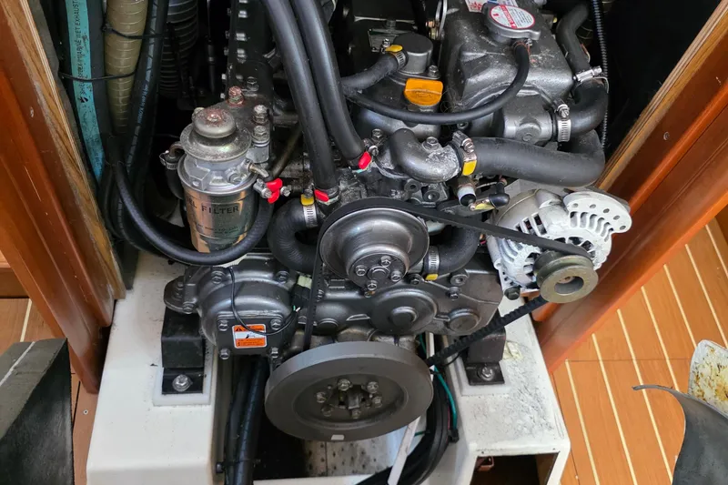 Engine compartment of a 2007 Jeanneau 49 Performance sailboat, showcasing mechanical components.