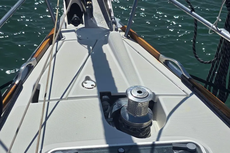 Deck of 2007 Jeanneau 49 Performance sailboat with winch and ropes.