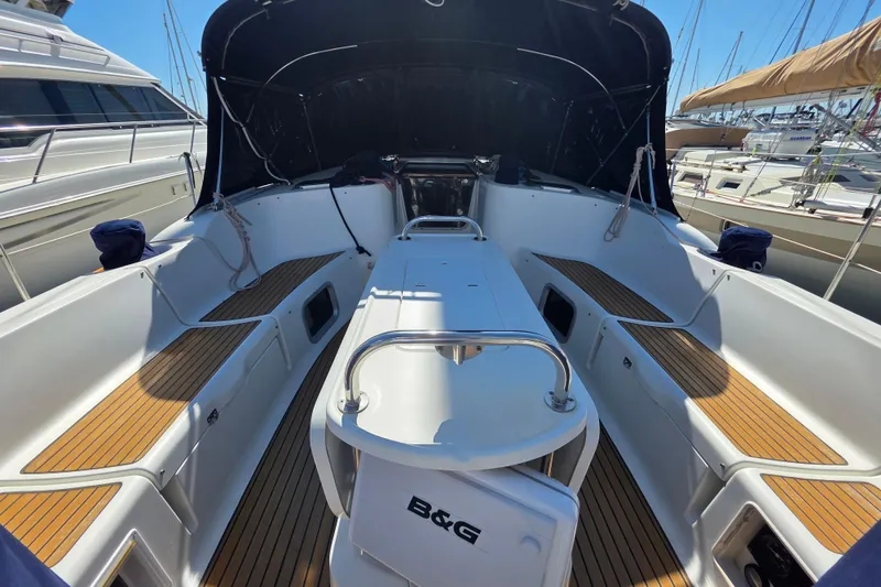 2007 Jeanneau 49 Performance yacht cockpit with teak flooring and covered seating area.
