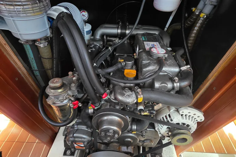 Engine of 2007 Jeanneau 49 Performance sailboat, showcasing mechanical components and hoses.