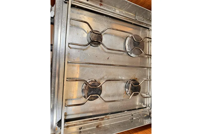 Stainless steel stove top on Jeanneau Sun Odyssey 49 Performance yacht, 2007 model.