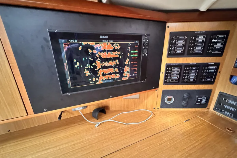 Navigation panel of 2007 Jeanneau Sun Odyssey 49 Performance yacht with radar display.