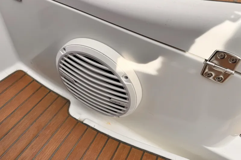 White speaker on Jeanneau Sun Odyssey 49 Performance, 2007, with teak flooring.