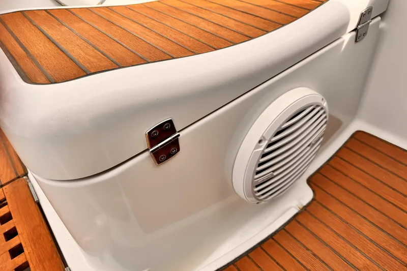 Teak deck and speaker on 2007 Jeanneau Sun Odyssey 49 Performance yacht.
