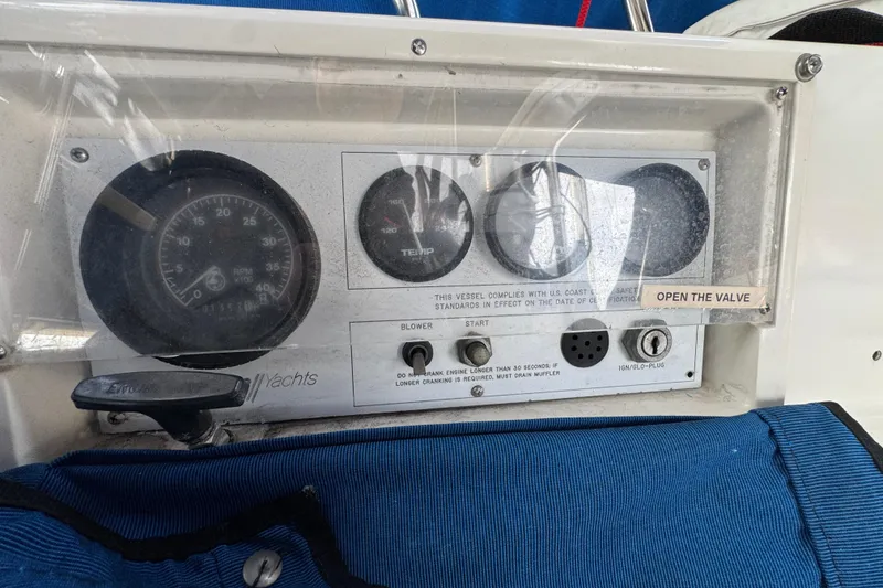 Control panel of a 1991 Catalina 36MKI yacht with gauges and switches.