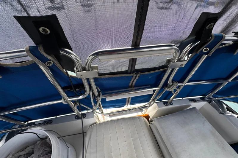 1991 Catalina 36MKI sailboat cockpit with blue canopy and stainless steel frame.