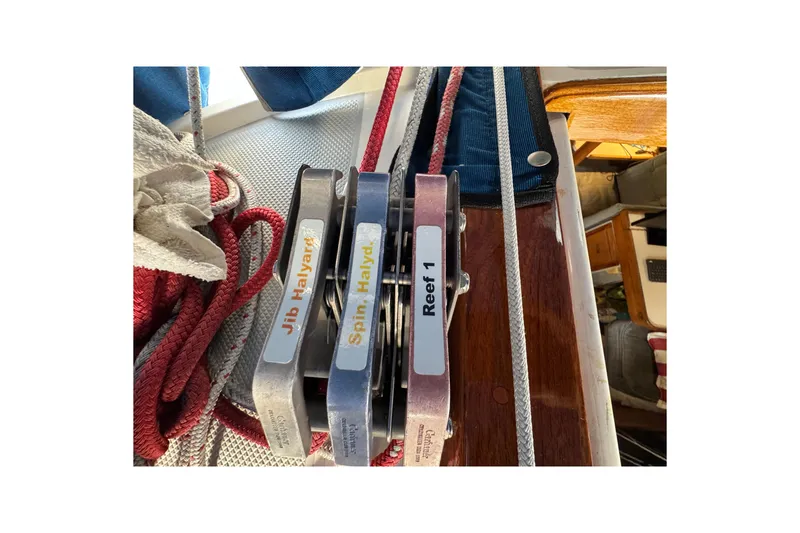 Sailing equipment on a 1991 Catalina 36MKI, featuring labeled halyard clutches and ropes.