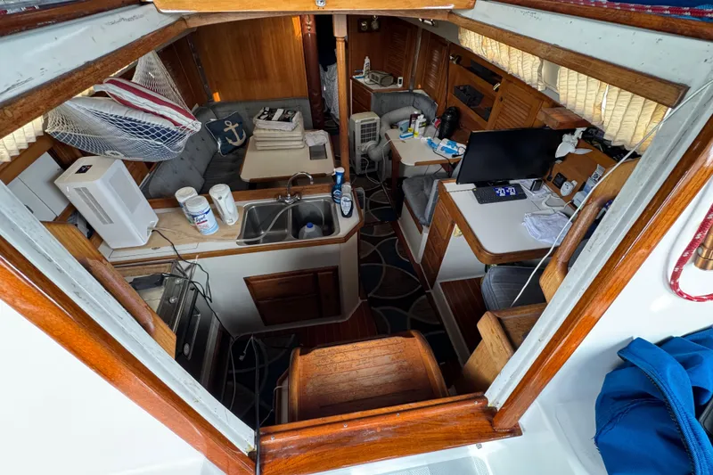 Interior of 1991 Catalina 36MKI sailboat with kitchen, seating, and navigation area.