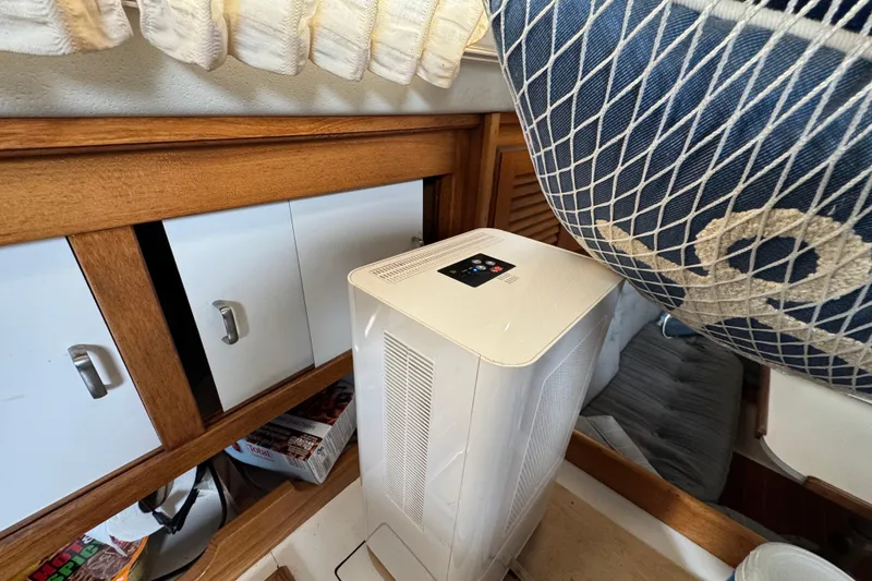 1991 Catalina 36MKI interior with air purifier and nautical decor.