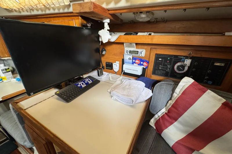 1991 Catalina 36MKI interior with monitor, keyboard, and nautical equipment.