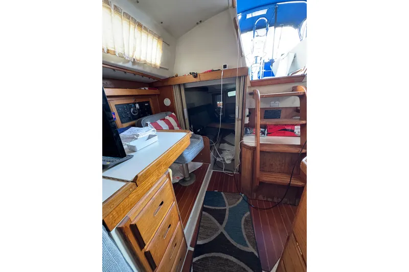 Interior of 1991 Catalina 36MKI sailboat with wooden cabinetry and seating area.