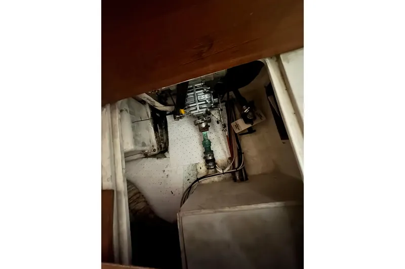 Engine compartment of a 1991 Catalina 36MKI sailboat, showing mechanical components and wiring.