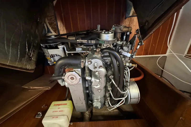 Engine of a 1991 Catalina 36MKI sailboat, showcasing mechanical components and wiring.