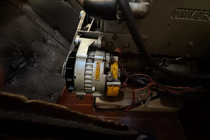 Engine compartment of a 1991 Catalina 36MKI sailboat, featuring alternator and wiring.