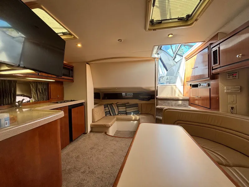 Luxurious interior of a 1998 Trojan 400 yacht with modern amenities and comfortable seating.