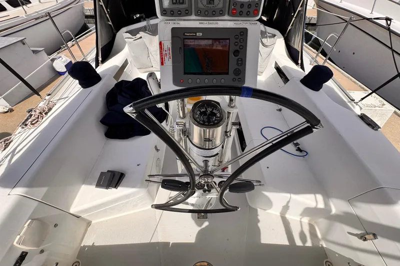 Cockpit of 2006 Catalina 34 MkII sailboat with navigation equipment and steering wheel.