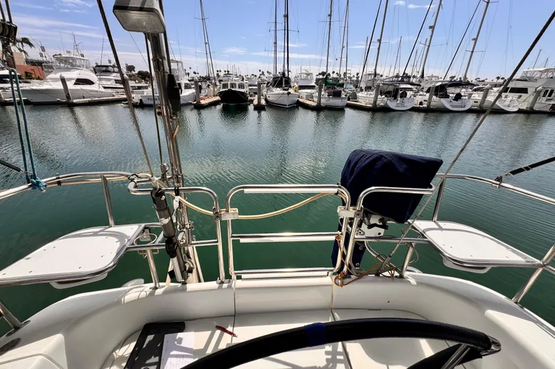 View from a 2006 Catalina 34 MkII sailboat cockpit in a marina.