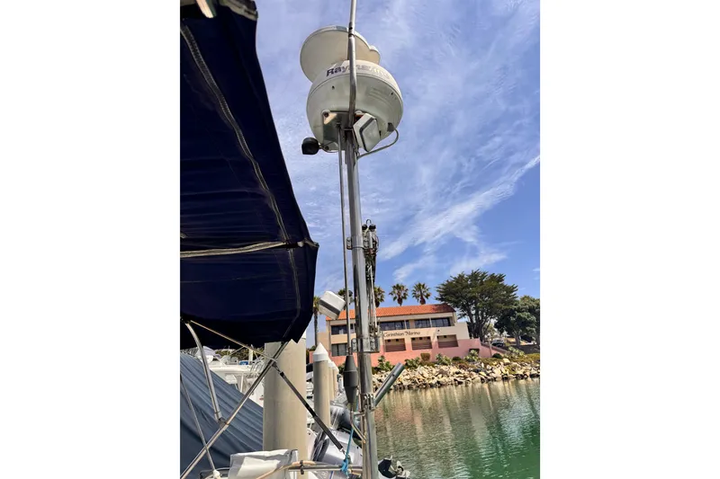 Sailboat mast with radar, Catalina 34 MkII, 2006, docked at marina.