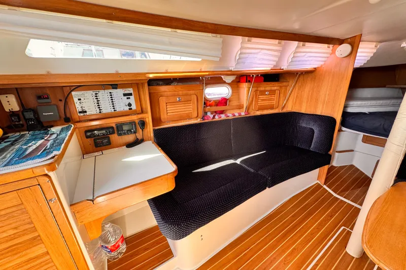 Interior of a 2006 Catalina 34 MkII sailboat with wood finish and navigation station.