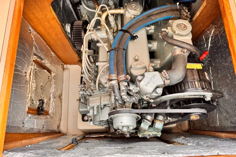Engine compartment of a 2006 Catalina 34 MkII sailboat, showcasing detailed mechanical components.