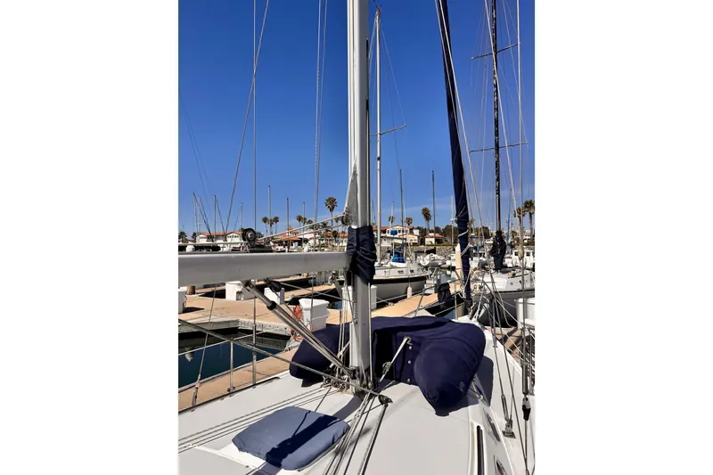 2006 Catalina 34 MkII sailboat docked at marina under clear blue sky.