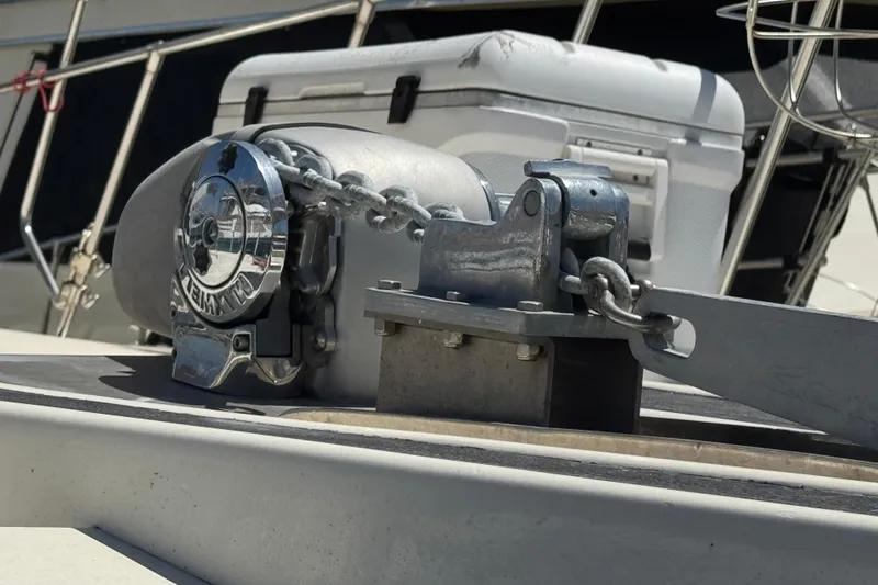 Anchor winch on 1985 Hatteras 45 Convertible boat deck, close-up view.