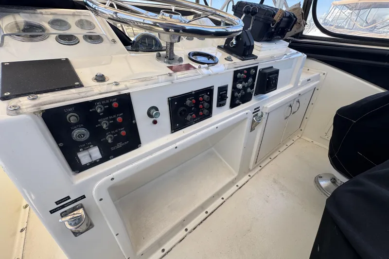 Control panel of a 1985 Hatteras 45 Convertible yacht cockpit.