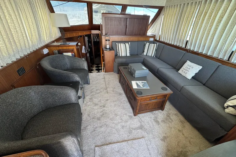 Interior of 1985 Hatteras 45 Convertible yacht with cozy seating and elegant decor.