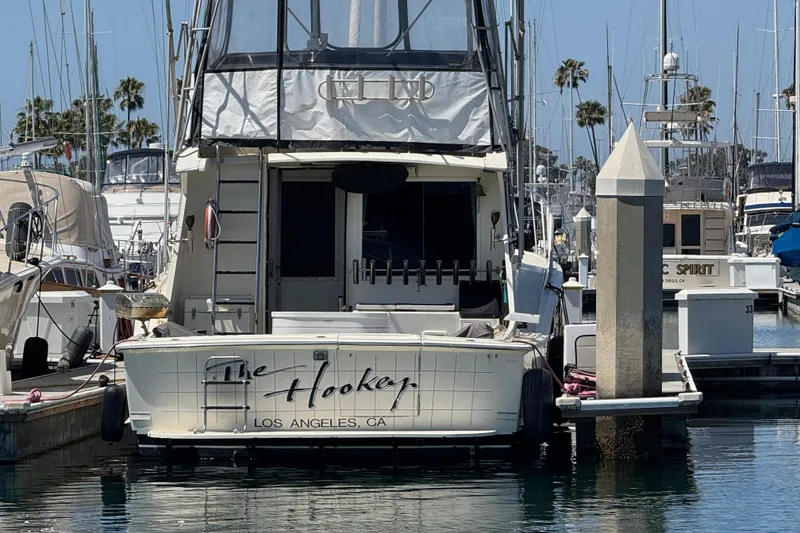 1985 Hatteras 45 Convertible yacht docked in a marina, Los Angeles, CA.