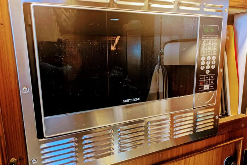 Built-in Greystone microwave in 1985 Hatteras 45 Convertible yacht kitchen.