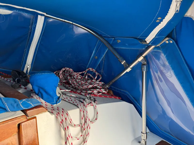 Interior view of a 1990 Catalina 30 MkII sailboat with blue canopy and ropes.