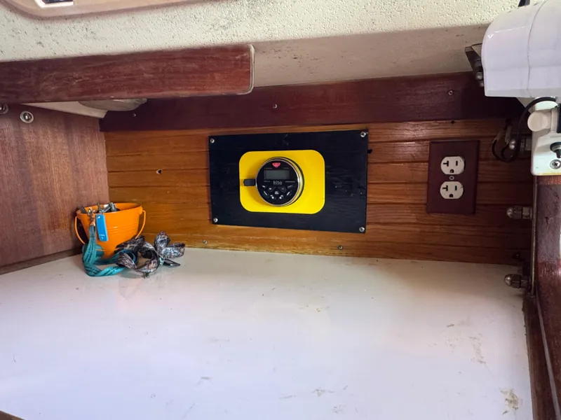 Interior of 1990 Catalina 30 MkII sailboat with electrical panel and outlet.