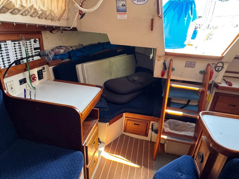Interior of a 1990 Catalina 30 MkII sailboat with seating, table, and storage.