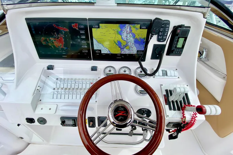 2006 Donzi 38 ZSF boat dashboard with navigation screens and controls.