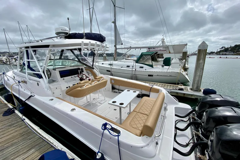 2006 Donzi 38 ZSF boat docked at marina with overcast sky.