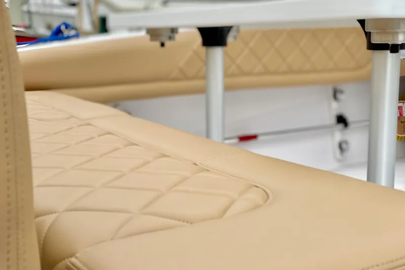 Luxurious beige seating on a 2006 Donzi 38 ZSF boat, showcasing diamond stitching.