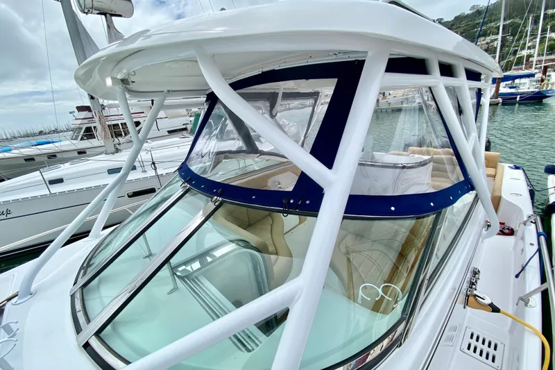 2006 Donzi 38 ZSF boat docked at marina, featuring sleek design and spacious cockpit.