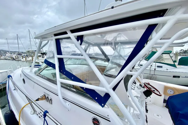 2006 Donzi 38 ZSF boat docked at marina, featuring sleek design and sturdy framework.