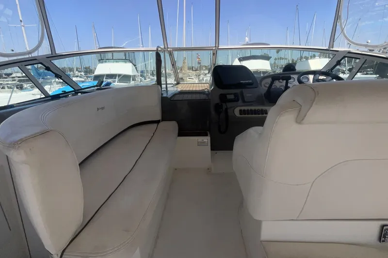 Interior view of 2006 Cruisers Yachts 370 Express, featuring helm and seating area.
