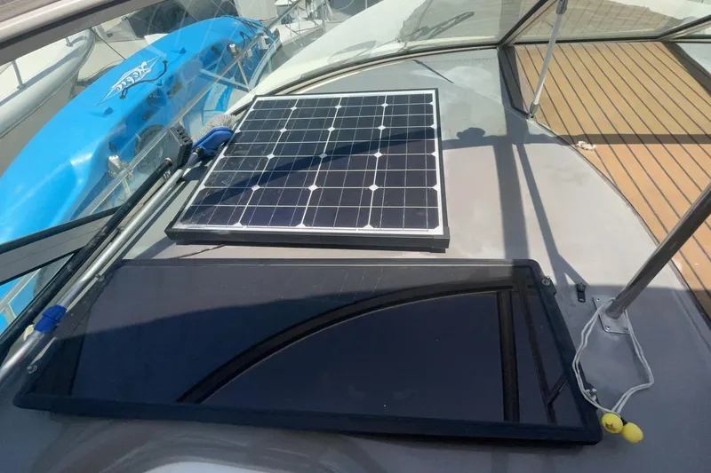 2006 Cruisers Yachts 370 Express with solar panel on deck, featuring sleek design.