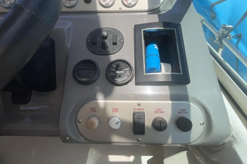Control panel of a 2006 Cruisers Yachts 370 Express with various switches and gauges.