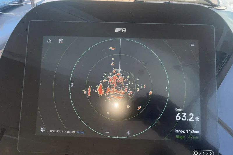 Radar display on a 2006 Cruisers Yachts 370 Express, showing depth of 63.2 feet.