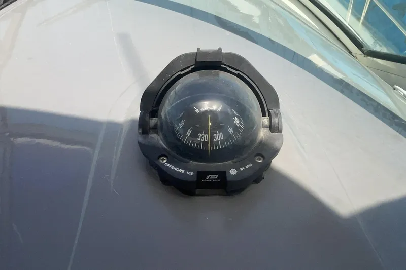 Compass on 2006 Cruisers Yachts 370 Express, displaying navigation directions.