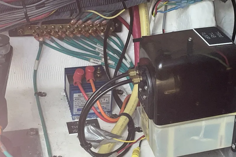 Electrical components and wiring inside a 2006 Cruisers Yachts 370 Express boat.