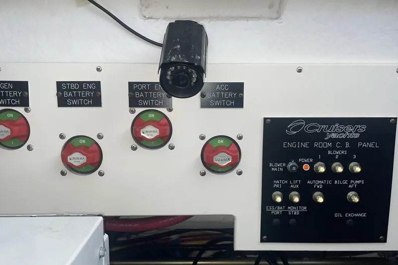 Engine room control panel of 2006 Cruisers Yachts 370 Express with battery switches.