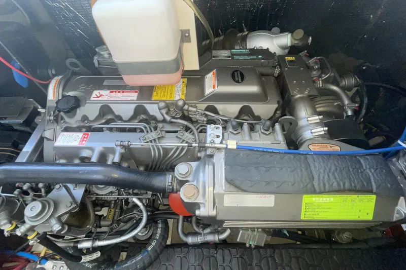 Engine compartment of a 2006 Cruisers Yachts 370 Express, showcasing detailed mechanical components.