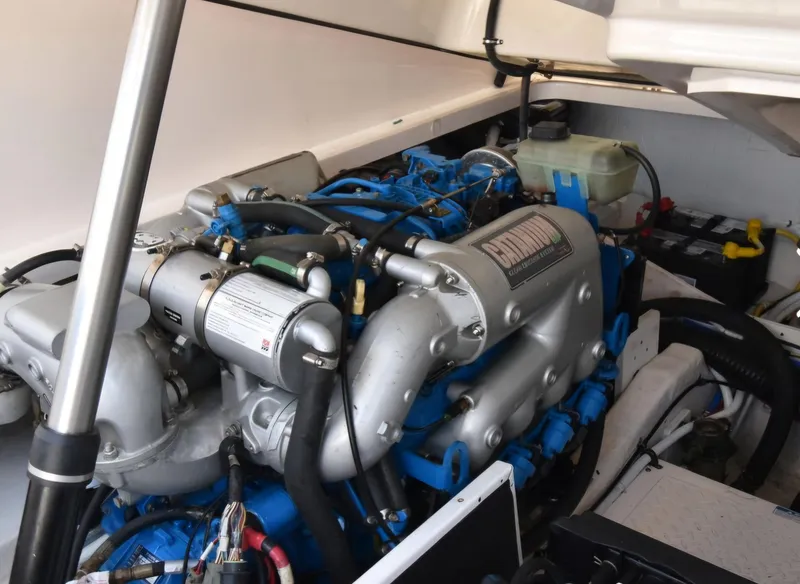 Engine compartment of a 2012 Tiara Yachts 3100 Coronet, showcasing detailed mechanical components.