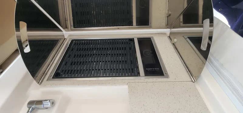 2012 Tiara Yachts 3100 Coronet kitchen area with stove and sink.