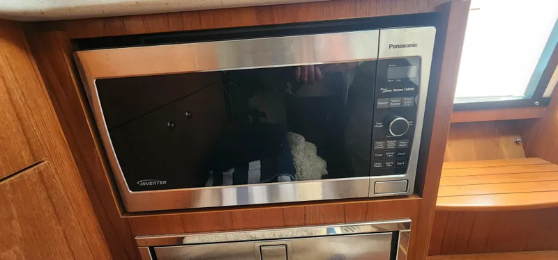Microwave in 2012 Tiara Yachts 3100 Coronet, wooden interior detail.